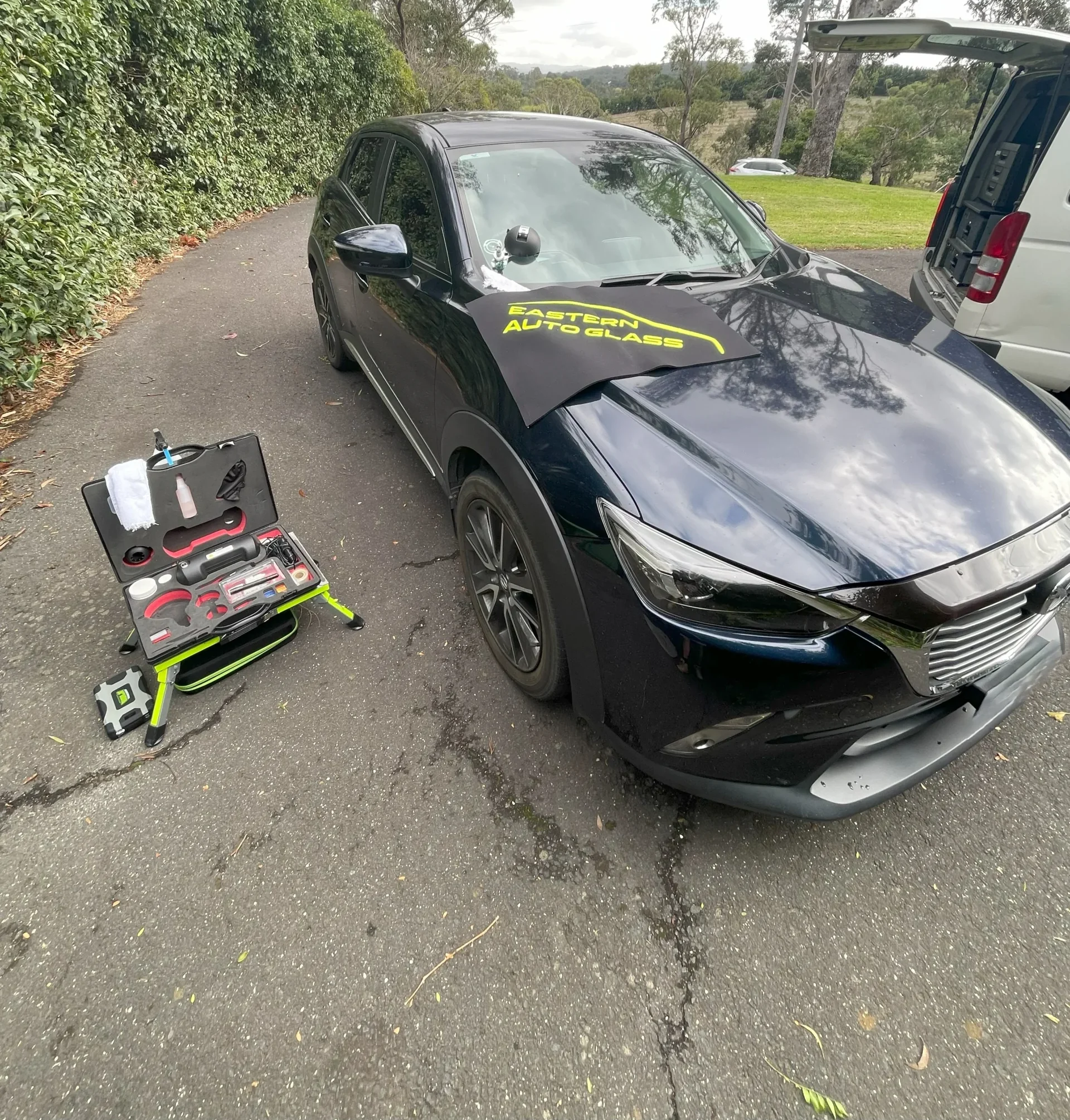 Close up of a professional stone chip repair being performed on a car windscreen in Pakenham. Mobile Windscreen Repairs
